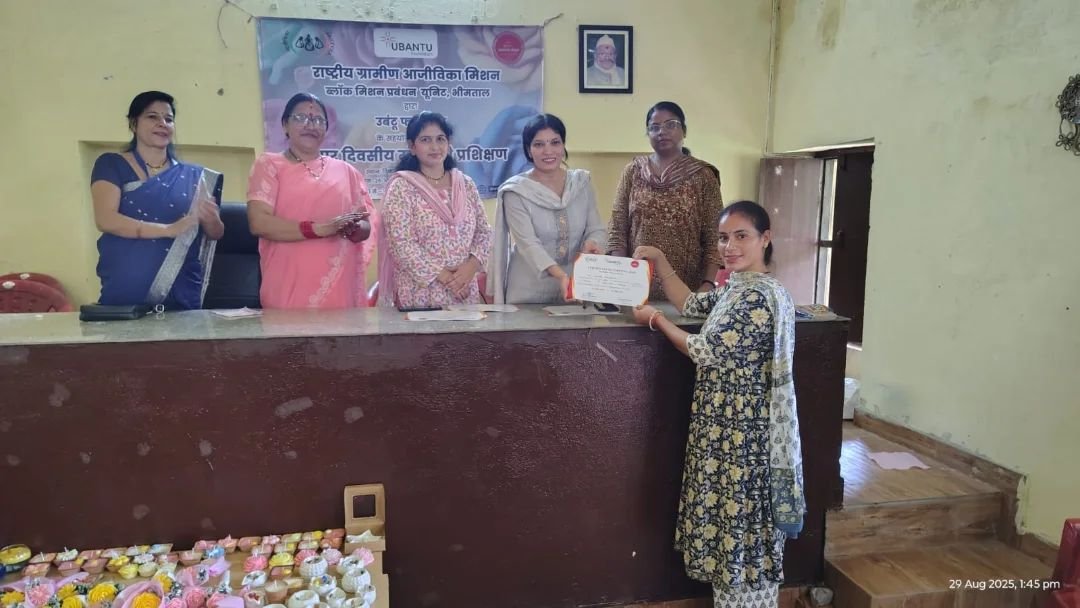 Certificates being presented at the candle making training at Bhimtal, Uttarakhand, completed 2 September 2025