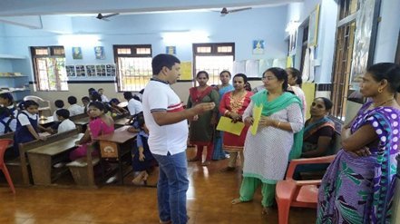 A classroom training session with participants and a trainer in Delhi