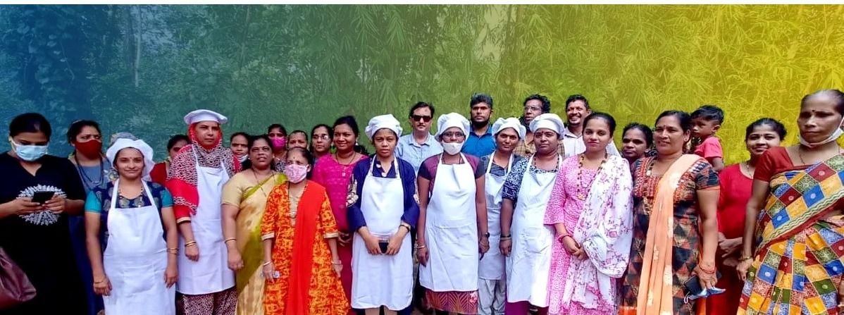 Participants in aprons at a food processing training programme