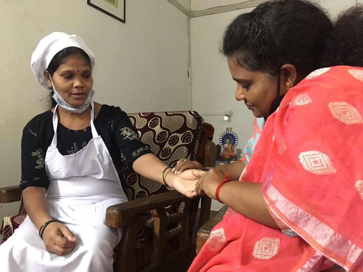 A felicitation moment between two participants at the Goa livelihood centre