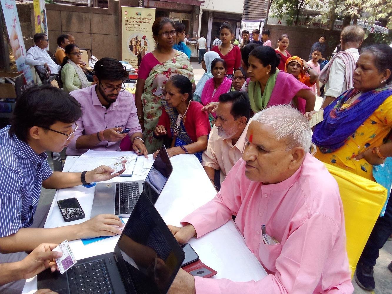Residents being helped to apply for government documents at a social protection camp