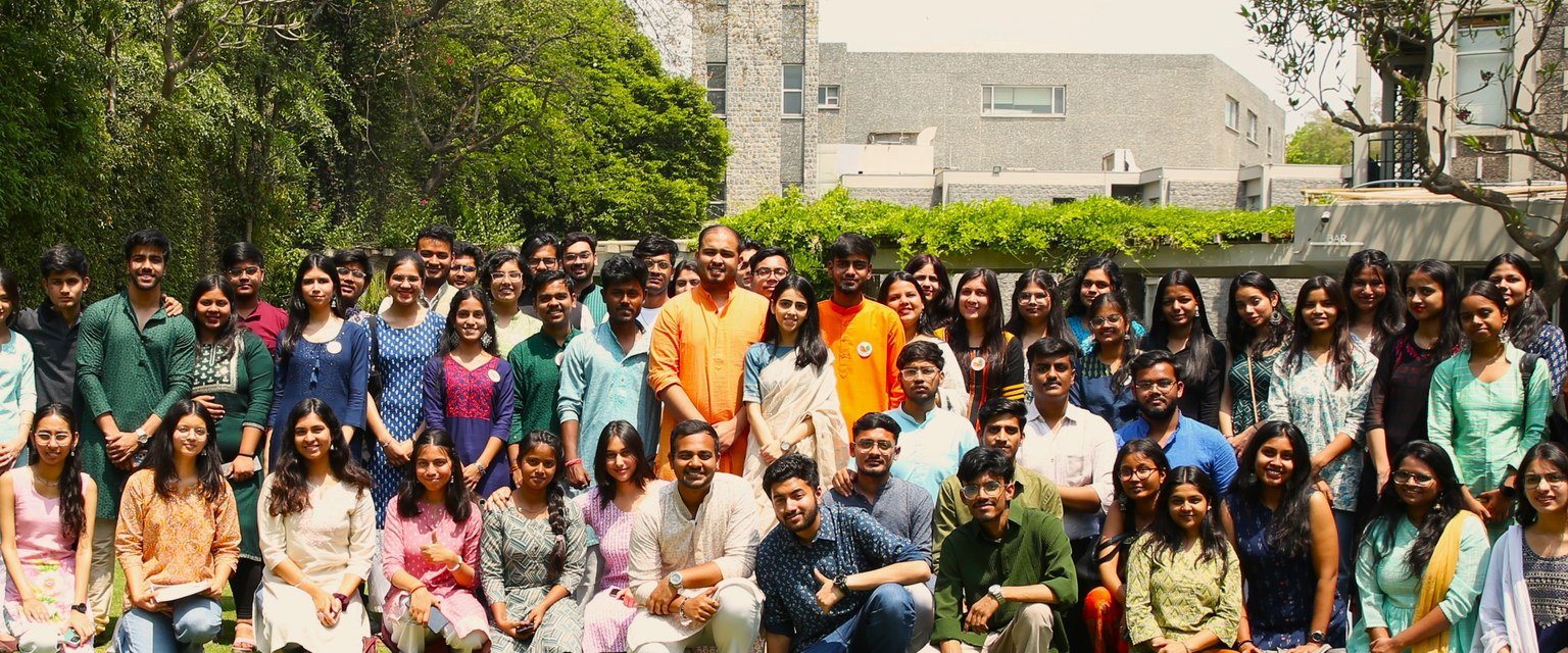 A group of young interns and volunteers gathered outdoors at Ubantu Foundation